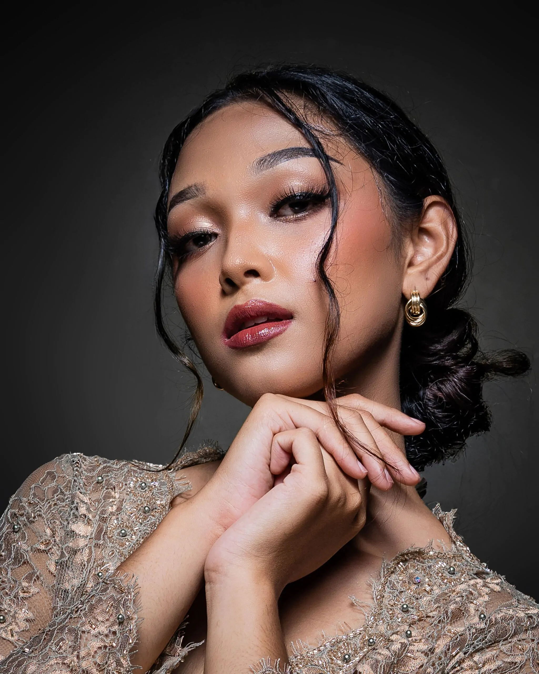 Sophisticated evening makeup style completed by a salon specialist